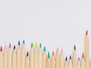 pexels-photo-743986-743986 A row of vibrant colored pencils aligned on a white background, providing ample copyspace.